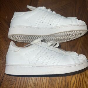 Adidas white sneakers size 2 kids.  Excellent used condition